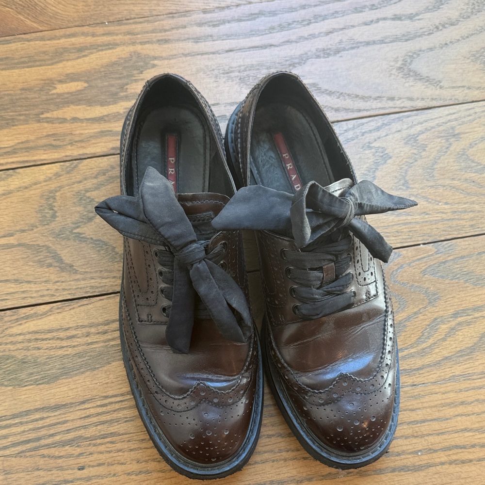 Prada Brown Leather Wingtip Oxfords with Black Fabric Bows